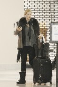 Phoebe Tonkin and Claire Holt - at New Orleans Airport - March 11, 2013