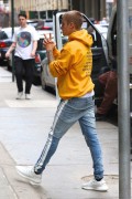 Justin Bieber - stands out in a bright yellow hoodie as he leaves his NYC hotel 05/27/2017